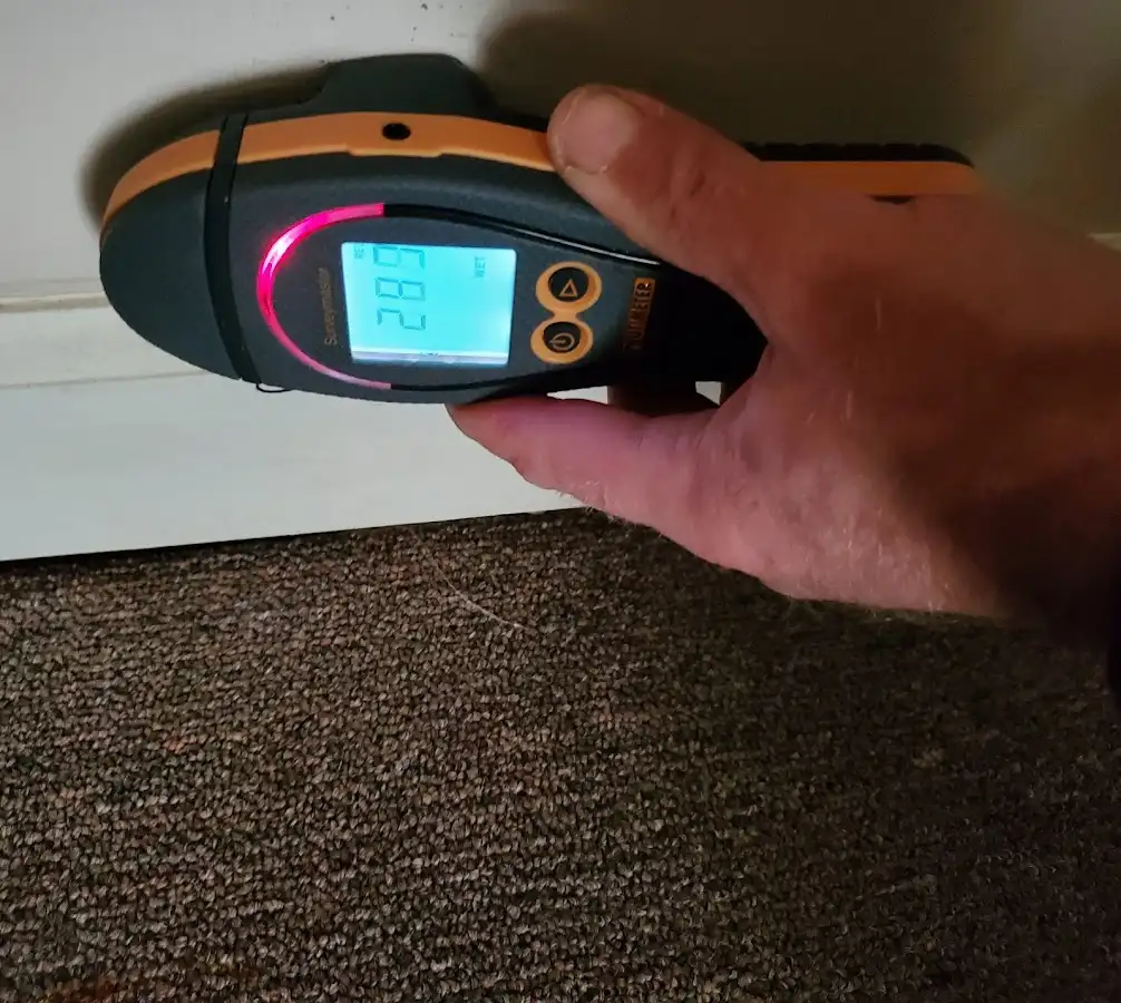 Moisture detection at baseboard during Storm Damage Restoration in Chillicothe